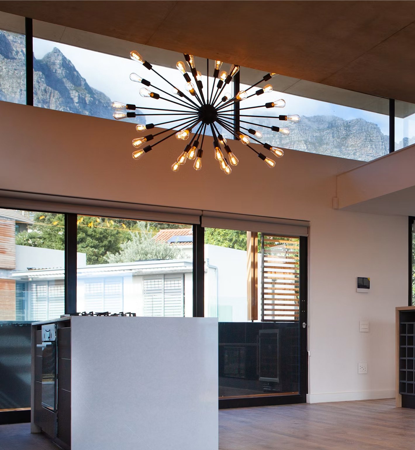 Living room with statement chandelier and large glass doors