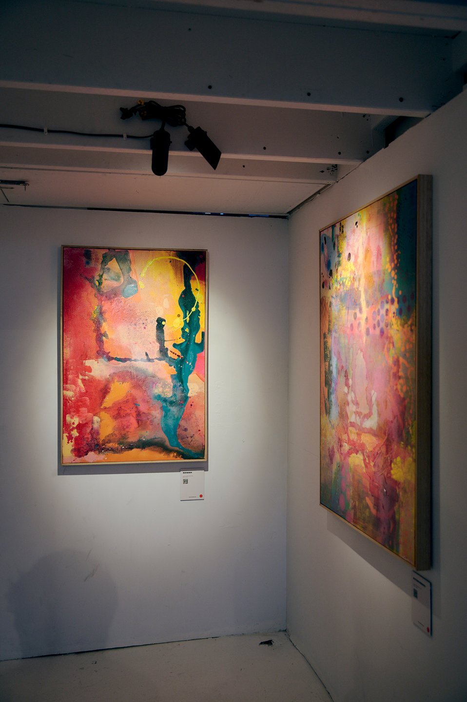 Colourful abstract artwork displayed on a feature wall