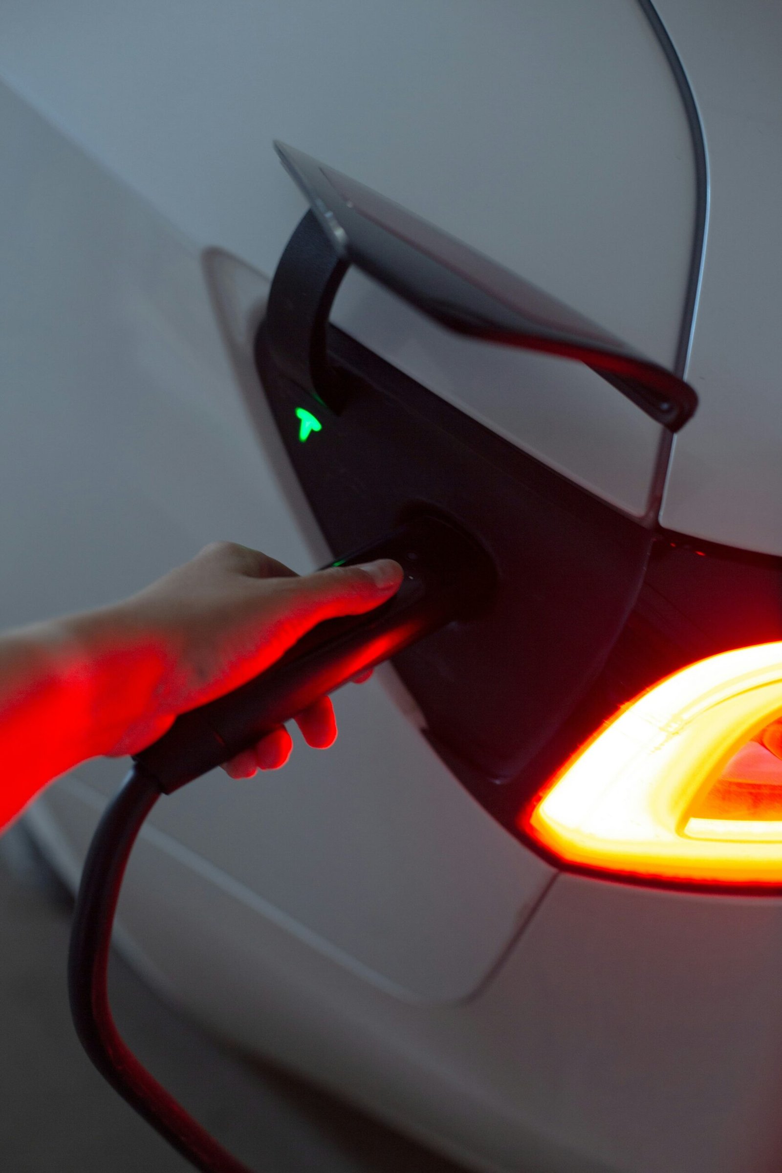 Close-up of a red car's rear taillight and bodywork