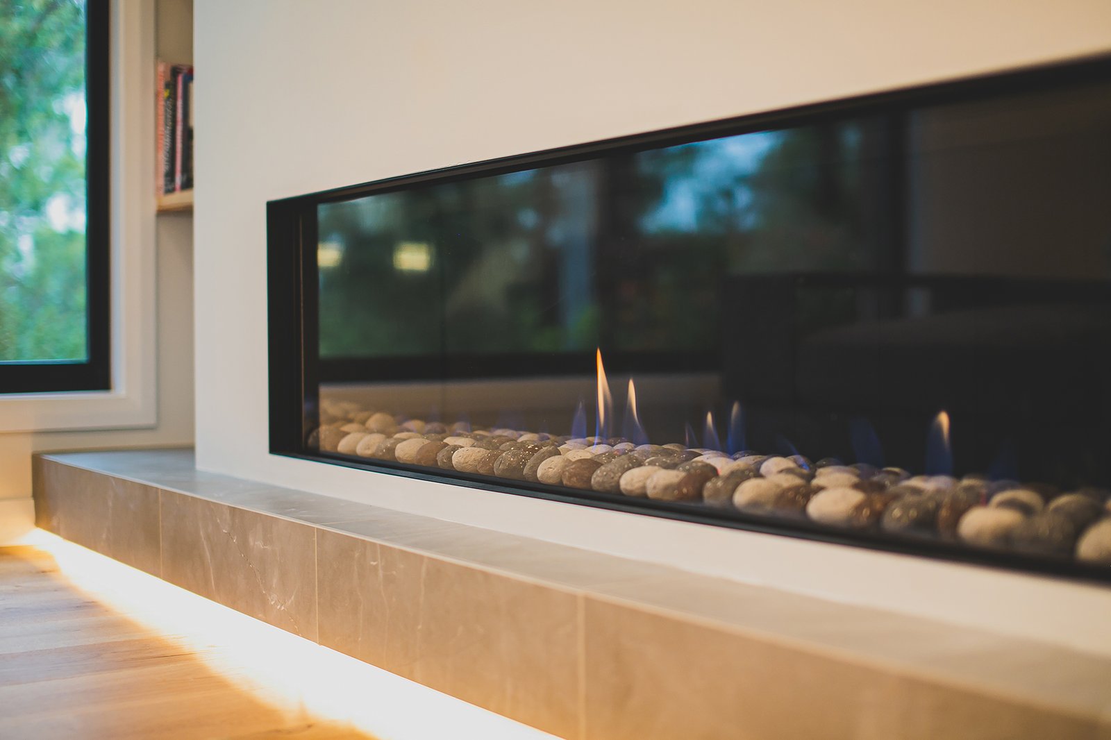 Wall-mounted TV with integrated ceiling lighting in a Wahroonga home