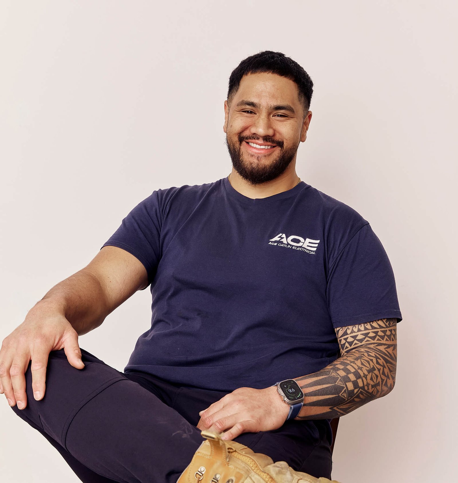 Ace Catlin Electrical electrician in ACE-branded uniform, smiling portrait